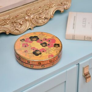 Boîte ronde métallique au décor floral